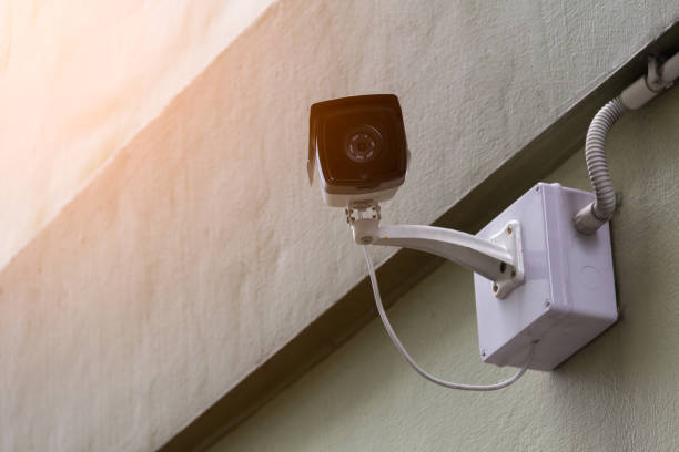 Security CCTV camera in office building, surveillance system.