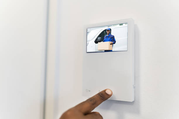 African Man Using Video Intercom Entrance Safety System